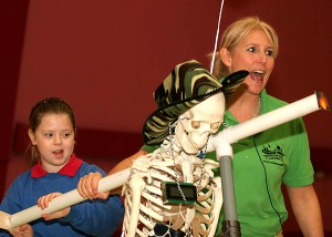How far did that projectile go?! Fred, Scientific Sues' Robot kindly lends his shoulder