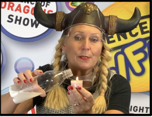 Scientific Sue demonstrating that carbon dioxide gas extinguishes fire