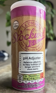 Close-up of Stockwell & Co. baking powder container used as a pH adjuster in Scientific Sue’s giant bubble recipe