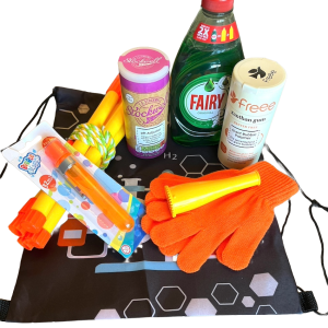 The Bubbleology Science Kit displayed on a surface. The kit includes Fairy Liquid, bicarbonate of soda, xanthan gum, a bubble blower, orange gloves, yellow bubble wands, a tri-string rope wand, and a black Science2Life drawstring bag with a chemistry-themed design.